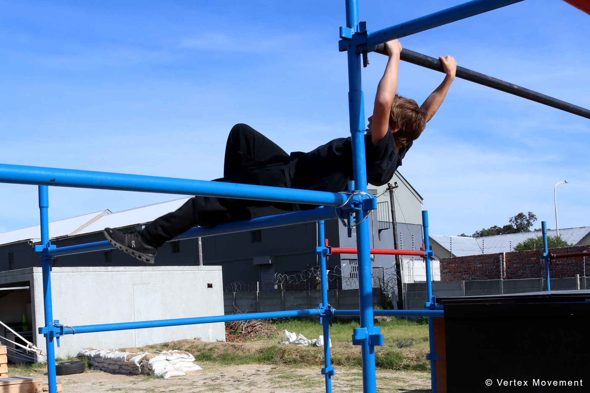 Vertex Movement athlete training on parkour bars