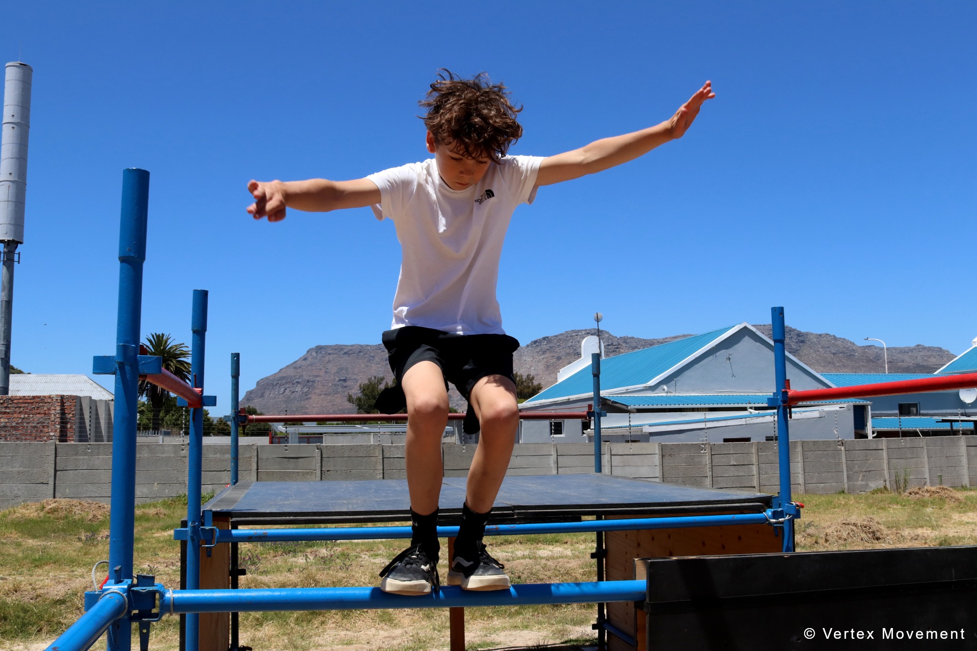 Young athlete balancing during parkour training at Vertex Movement